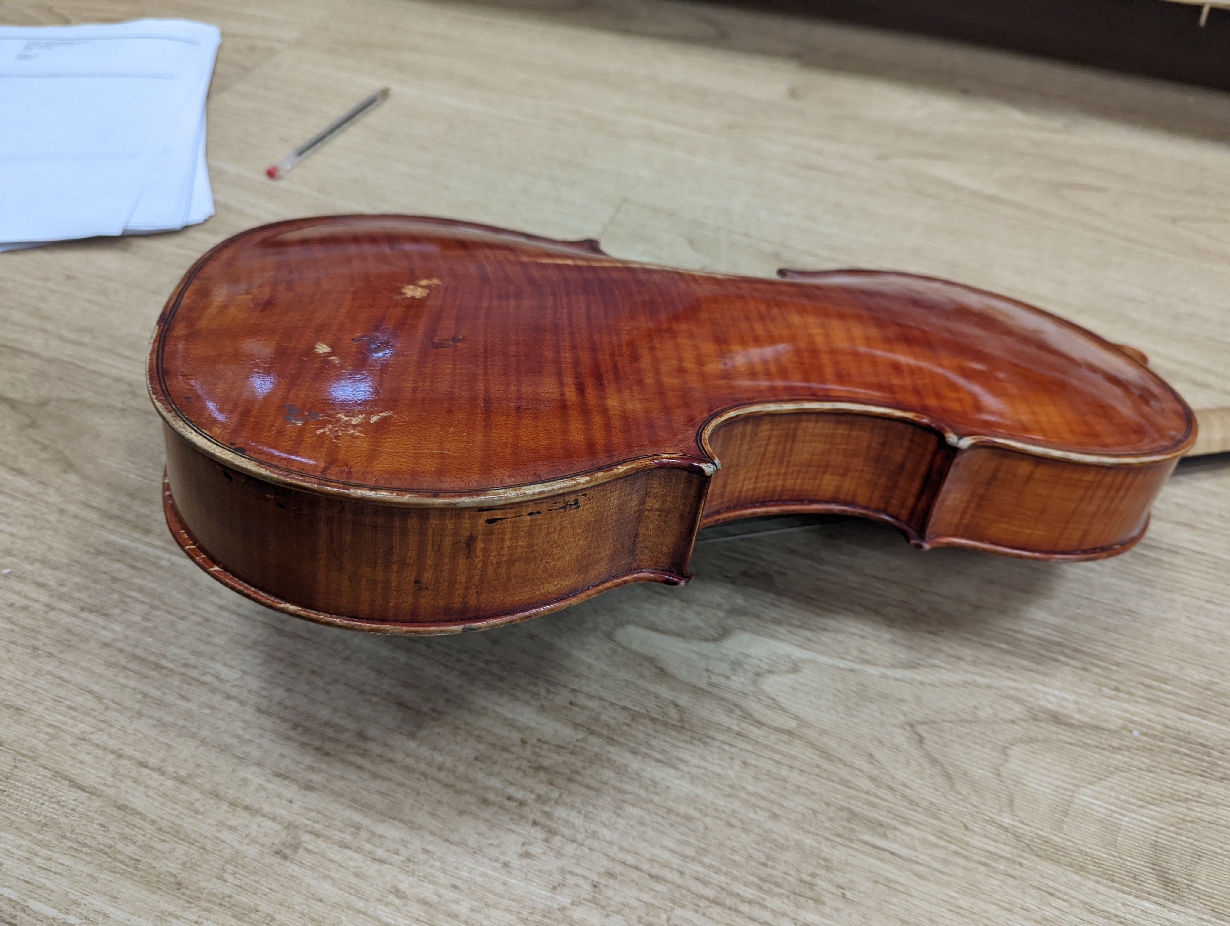 A Viola, assorted bows and a violin back